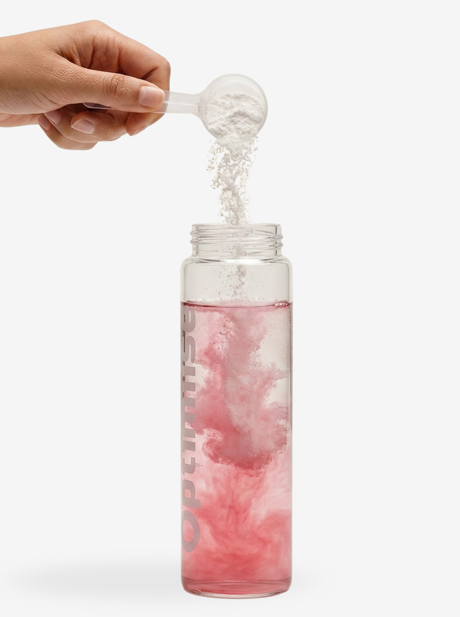 One scoop of Optimiise going into a bottle